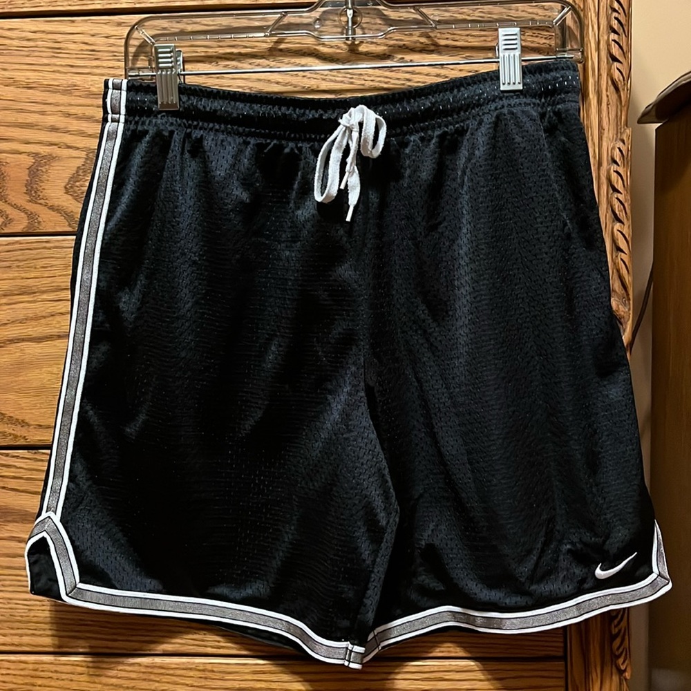 Women’s black and gold Nike athletic shorts
